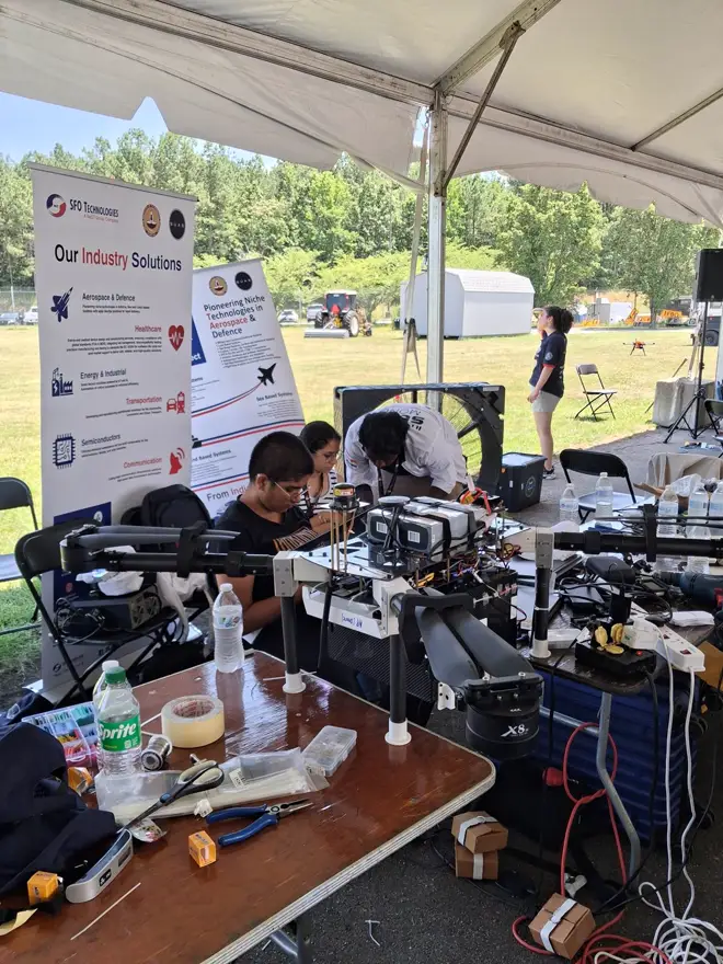 Assembling the 2025 UAV in the team tent at SUAS 2025