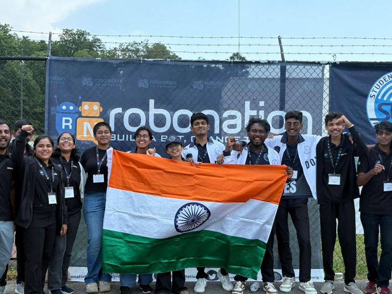 Team IIT Madras with the Indian flag at the RoboNation banner